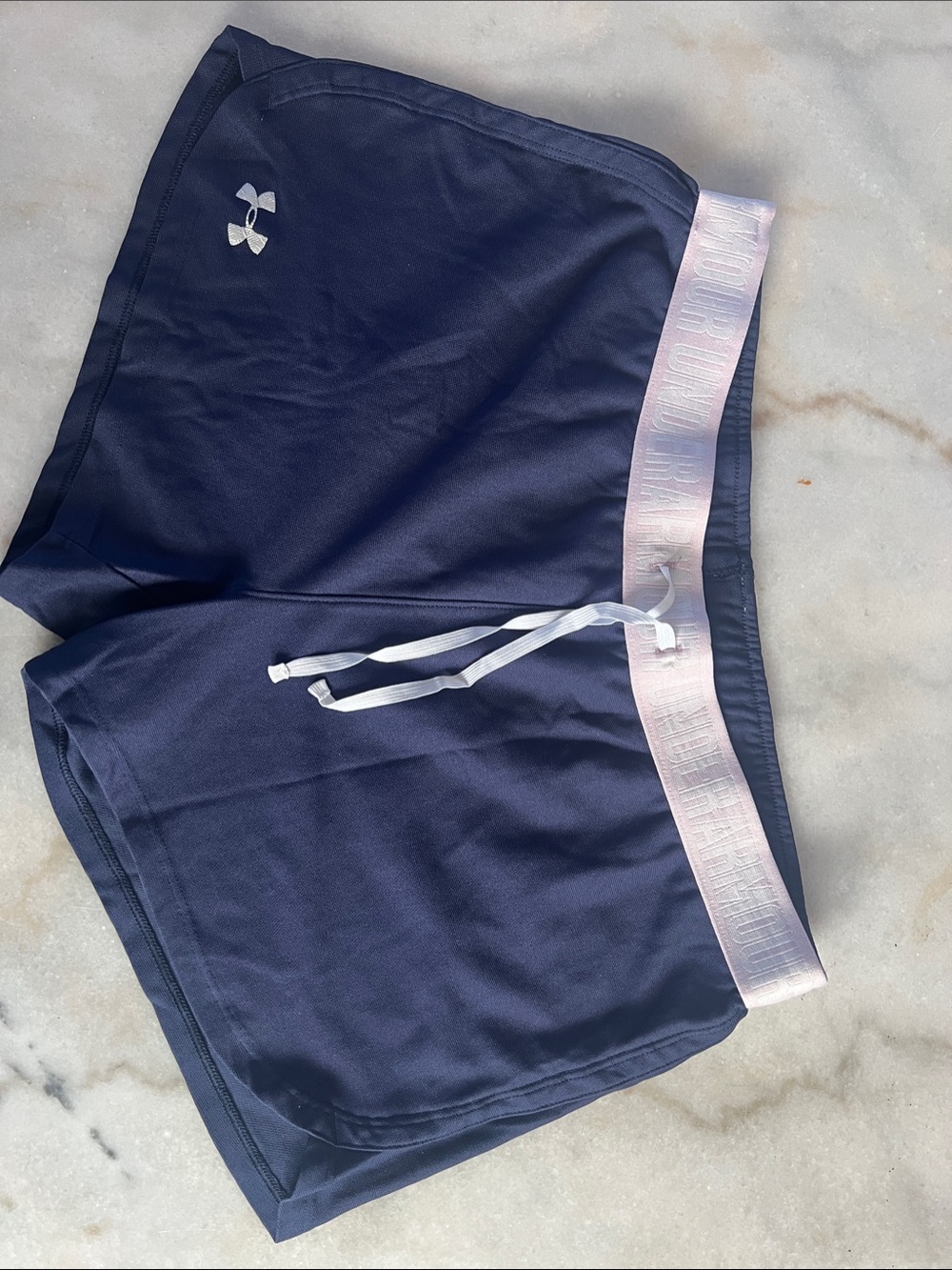 Under Armour navy shorts with pale pink waistband